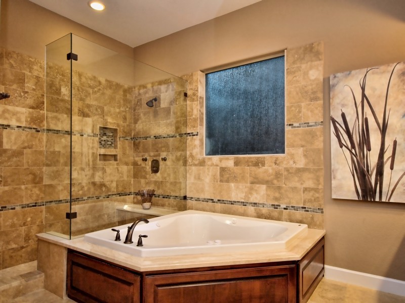Example of a large classic master beige tile and stone tile travertine floor bathroom design in Austin with raised-panel cabinets, dark wood cabinets, granite countertops and beige walls