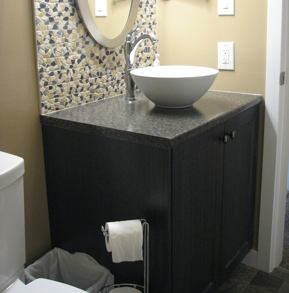 Design ideas for a small traditional shower room bathroom in Vancouver with shaker cabinets, dark wood cabinets, an alcove shower, a one-piece toilet, multi-coloured tiles, ceramic tiles, brown walls, ceramic flooring, a vessel sink and laminate worktops.