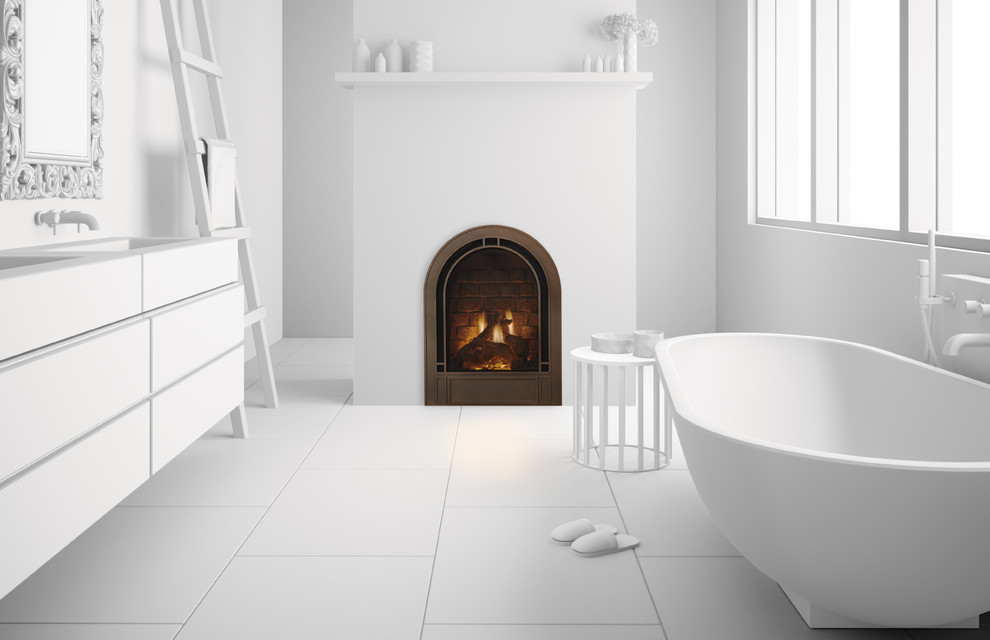 Cette image montre une salle de bain principale design de taille moyenne avec un placard à porte plane, des portes de placard blanches, une baignoire indépendante, un mur blanc, un lavabo intégré, un plan de toilette en surface solide et un sol blanc.