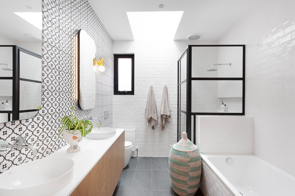 Example of a trendy master white tile and subway tile gray floor and double-sink bathroom design in Melbourne with flat-panel cabinets, medium tone wood cabinets, a one-piece toilet, white walls, a vessel sink, white countertops and a floating vanity