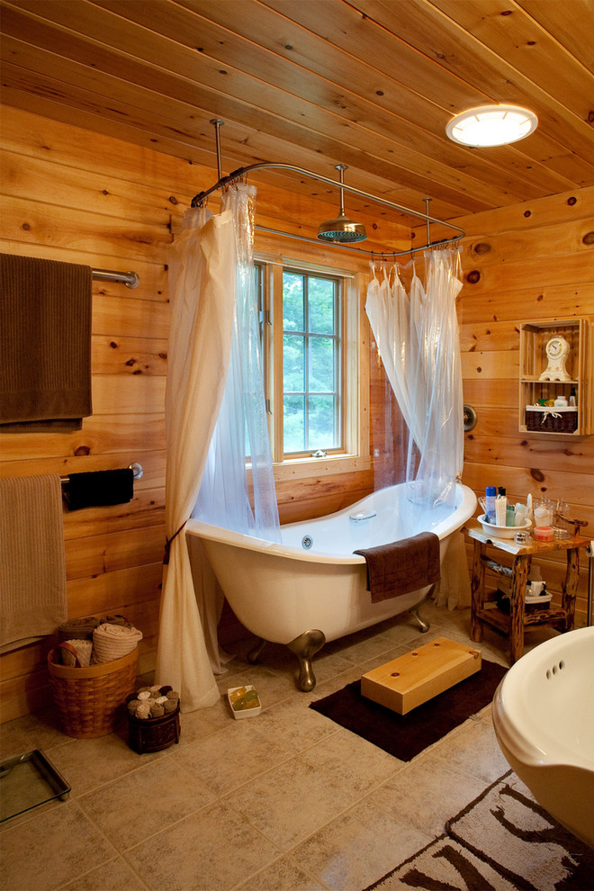 Photo of a traditional bathroom in Other with a claw-foot bath.