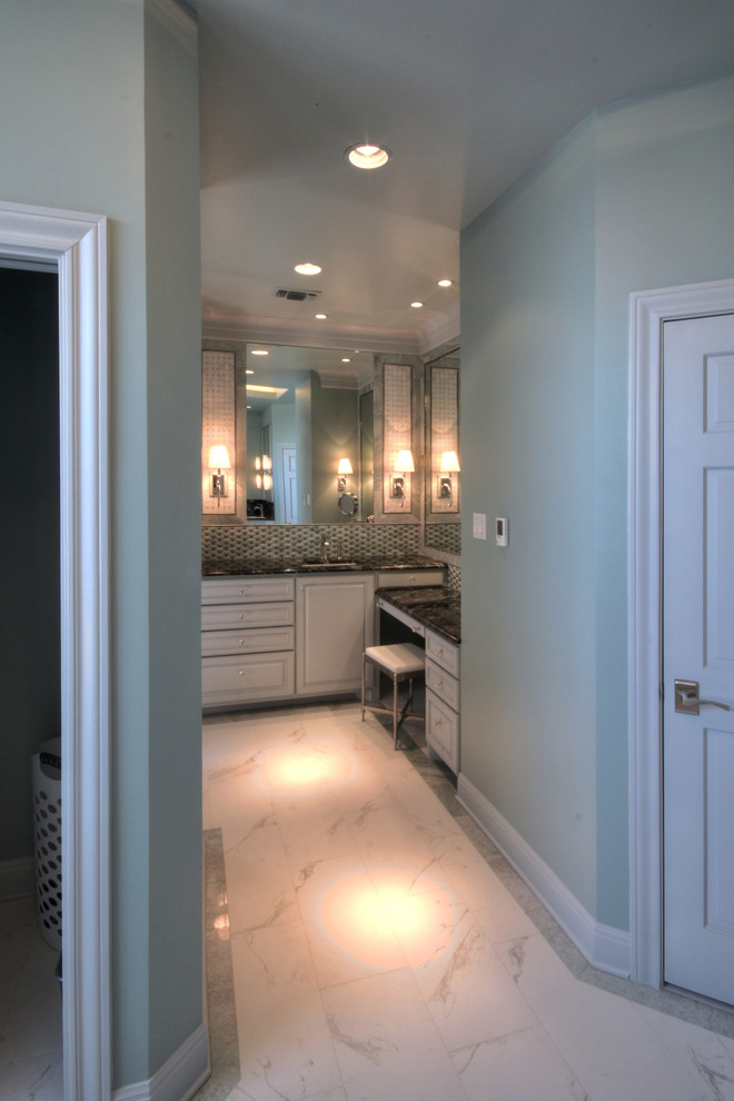 Photo of a large contemporary ensuite bathroom in Austin with raised-panel cabinets, white cabinets, granite worktops, white tiles, stone tiles, blue walls and porcelain flooring.