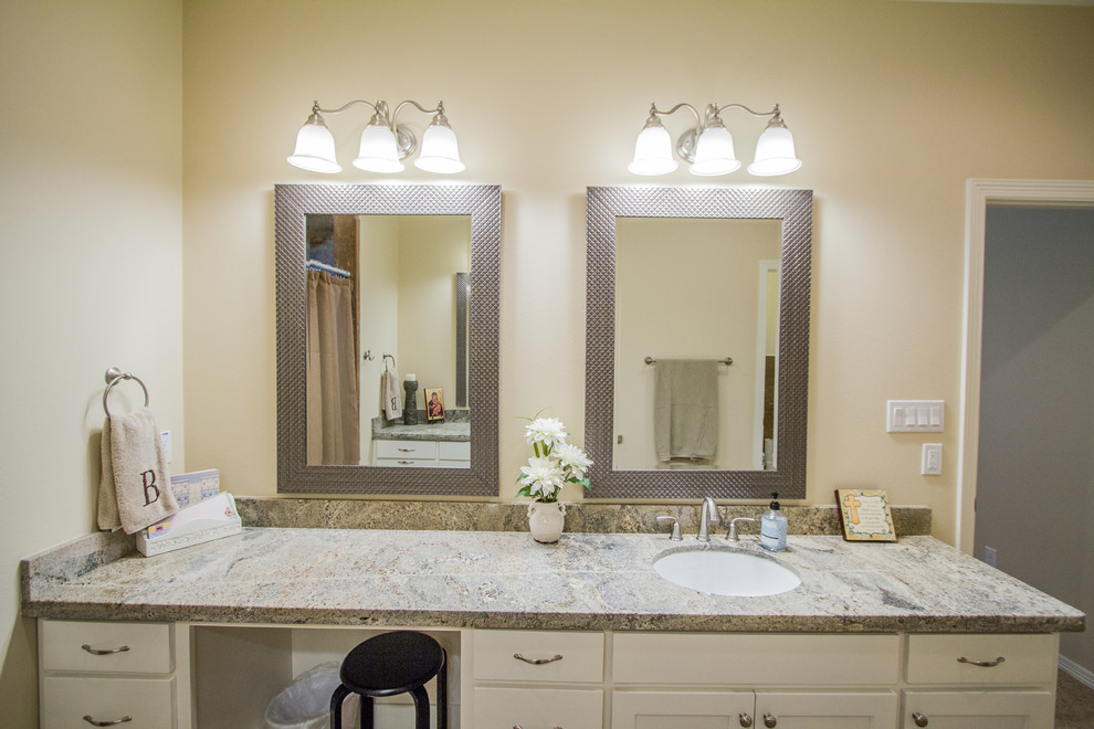 This is an example of a large contemporary ensuite bathroom in Austin with white cabinets, brown tiles, porcelain tiles, beige walls, porcelain flooring, a submerged sink, granite worktops and brown floors.