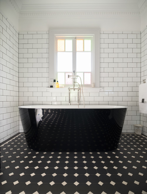Bathroom Design in Monochromatic Style Featuring a Black Freestanding Bathtub