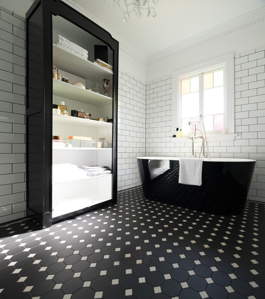 Inspiration for a large contemporary master white tile and subway tile porcelain tile and black floor freestanding bathtub remodel in Sydney with white walls and a pedestal sink