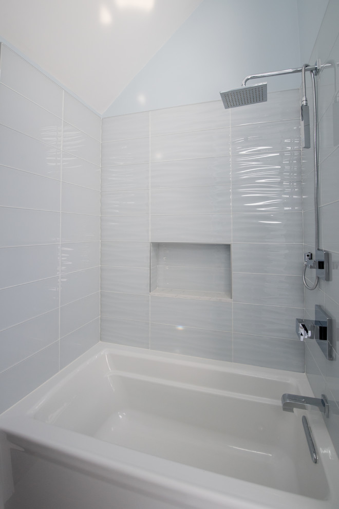 Medium sized contemporary ensuite bathroom in Boston with shaker cabinets, white cabinets, an alcove bath, an alcove shower, a one-piece toilet, blue tiles, glass tiles, blue walls, a submerged sink, quartz worktops, a shower curtain, white worktops, porcelain flooring and grey floors.