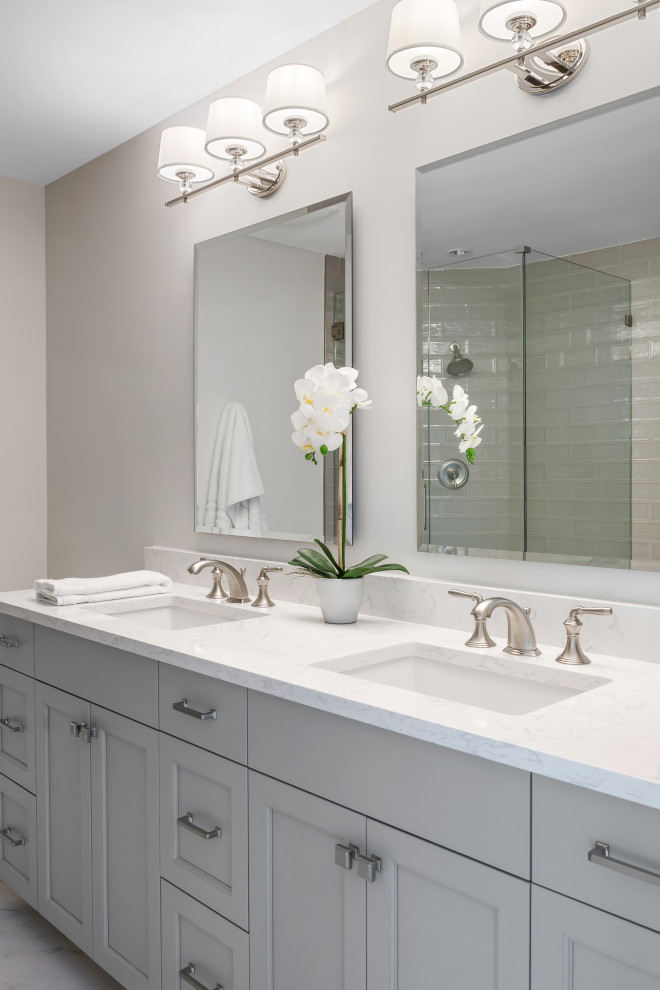 Inspiration for a mid-sized coastal kids' white tile and subway tile porcelain tile, white floor and double-sink bathroom remodel in Tampa with recessed-panel cabinets, gray cabinets, an undermount tub, a two-piece toilet, white walls, an undermount sink, quartz countertops, white countertops and a built-in vanity