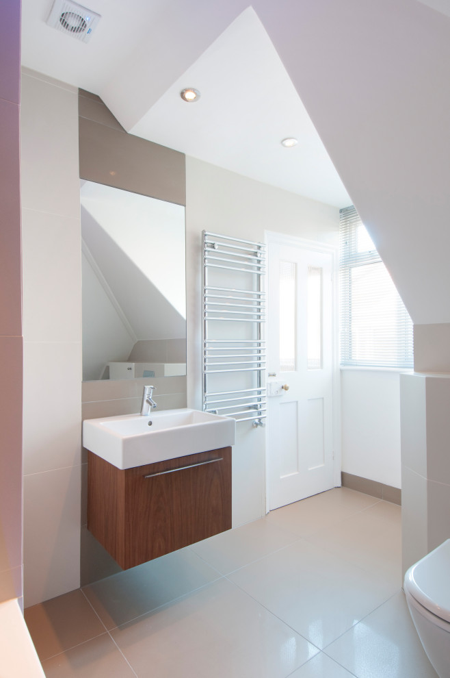 Photo of a medium sized contemporary shower room bathroom in London with flat-panel cabinets, medium wood cabinets, a wall mounted toilet, beige walls, an integrated sink, beige floors, white worktops, a single sink and a floating vanity unit.