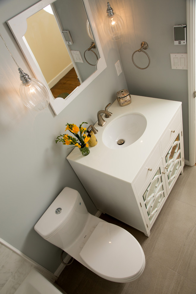 Bathroom - small transitional gray tile and stone tile porcelain tile bathroom idea in Los Angeles with an undermount sink, furniture-like cabinets, white cabinets, quartzite countertops, a one-piece toilet and gray walls