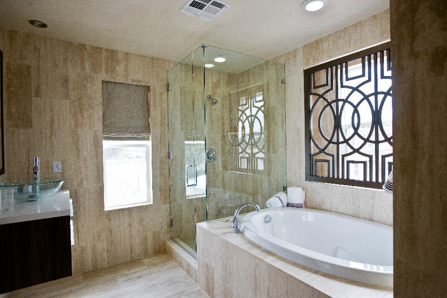 Cette image montre une salle de bain principale design en bois foncé de taille moyenne avec un placard à porte plane, une baignoire posée, une douche d'angle, un carrelage beige, des carreaux de céramique, un mur beige, un sol en carrelage de porcelaine, une vasque et un plan de toilette en quartz.