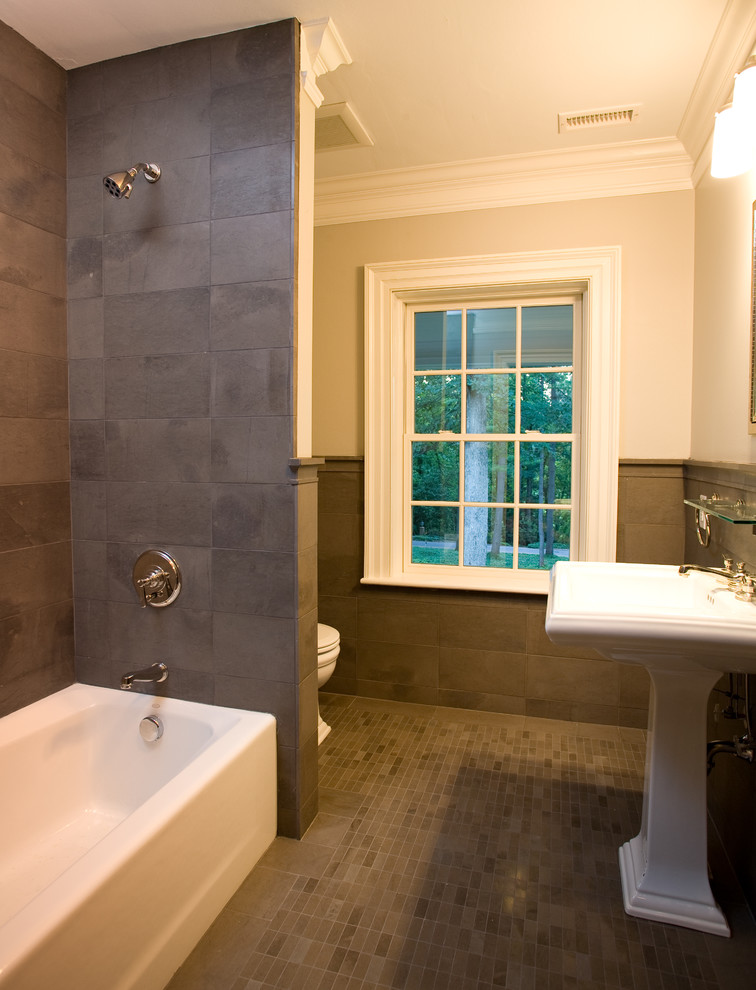 Example of a small transitional 3/4 gray tile and ceramic tile ceramic tile and multicolored floor bathroom design in Other with a two-piece toilet, beige walls and a pedestal sink