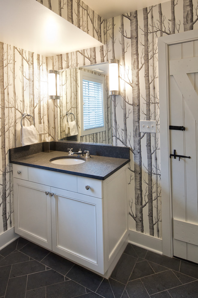 This is an example of a traditional ensuite bathroom in New York with beaded cabinets, white cabinets, white tiles, slate flooring, a submerged sink, soapstone worktops, black floors and black worktops.