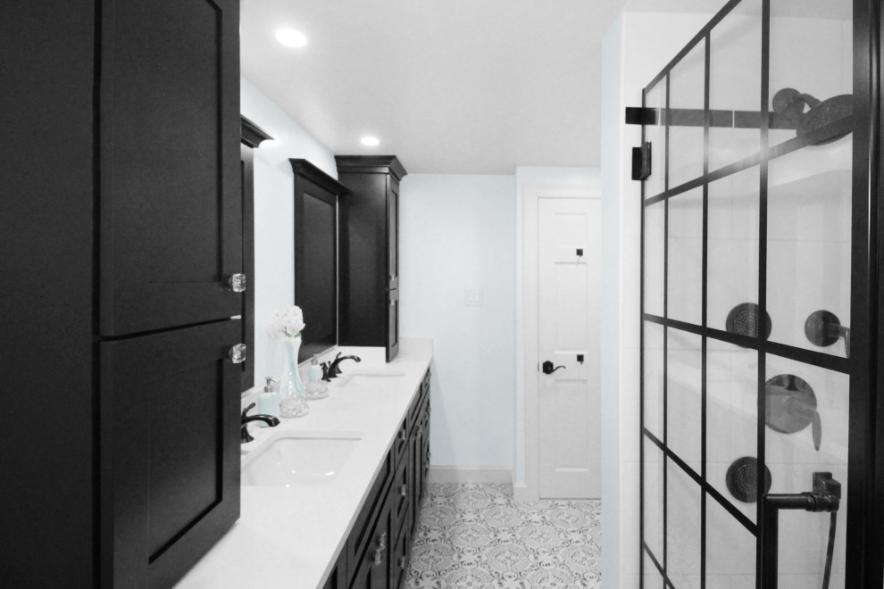 Design ideas for a medium sized modern family bathroom in Boston with shaker cabinets, black cabinets, an alcove shower, a two-piece toilet, white tiles, porcelain tiles, blue walls, porcelain flooring, a submerged sink, engineered stone worktops, black floors, a hinged door and white worktops.