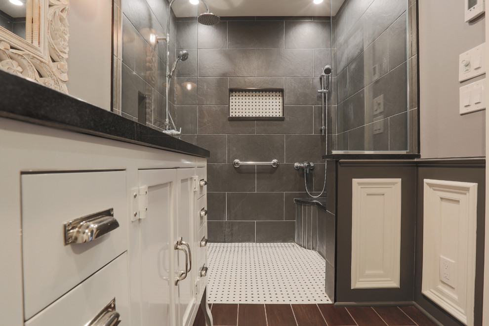 Bathroom - mid-sized transitional master porcelain tile and black floor bathroom idea in Baltimore with furniture-like cabinets, white cabinets, a two-piece toilet, gray walls, an undermount sink and granite countertops