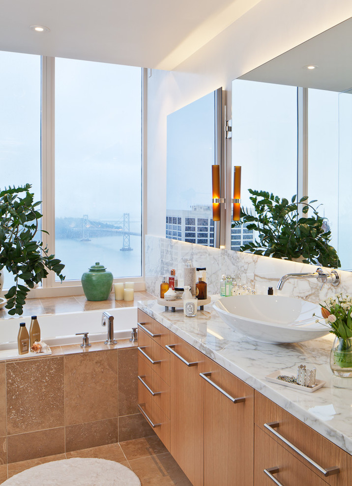 Design ideas for a contemporary bathroom in San Francisco with a vessel sink, flat-panel cabinets, medium wood cabinets, a built-in bath and white walls.
