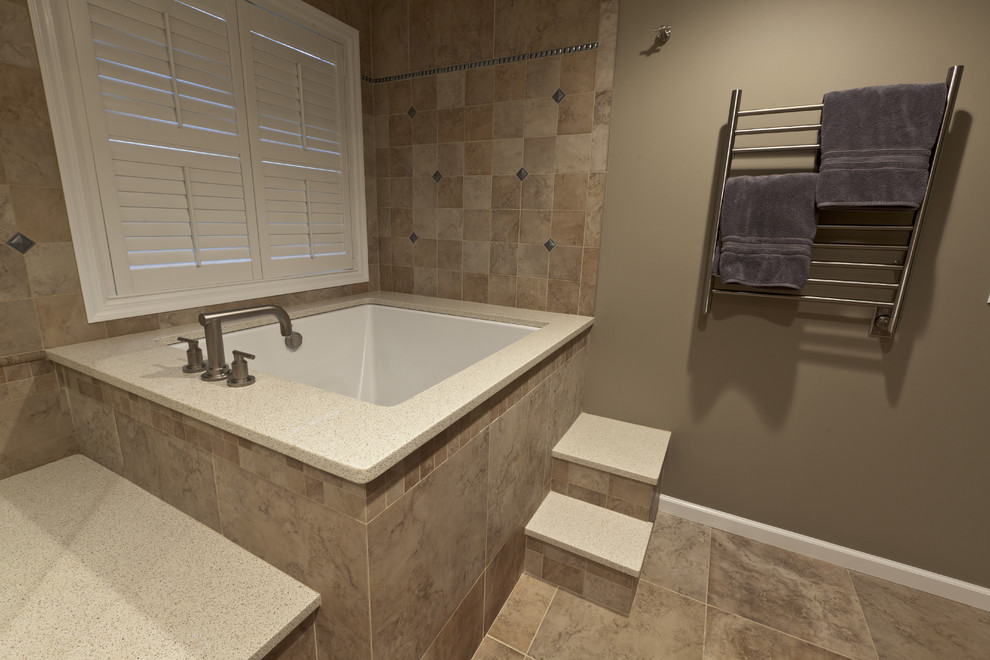 Bathroom - large traditional master beige tile and porcelain tile porcelain tile bathroom idea in Bridgeport with an undermount sink, recessed-panel cabinets, medium tone wood cabinets, quartz countertops, a two-piece toilet and beige walls