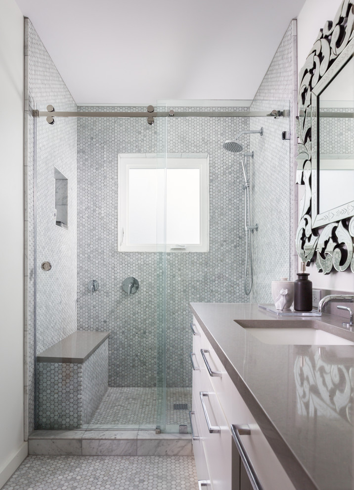 Bathroom - small transitional master gray tile and stone tile mosaic tile floor bathroom idea in Austin with an undermount sink, flat-panel cabinets, white cabinets, quartz countertops and white walls