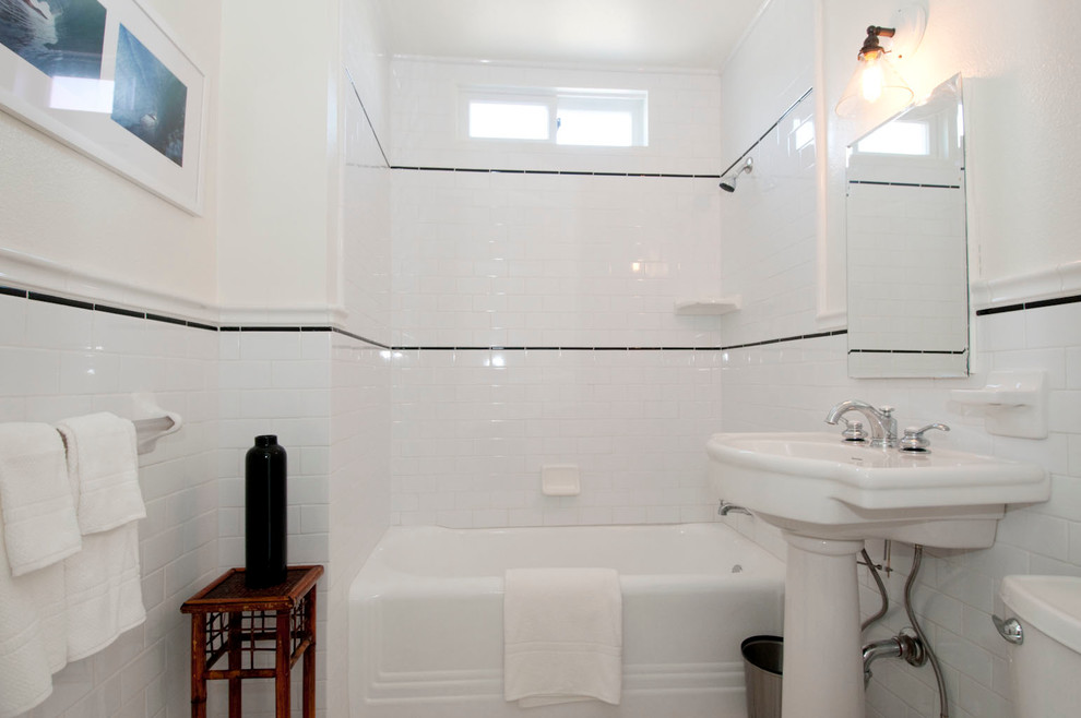 Example of a mid-sized country white tile and subway tile ceramic tile bathroom design in Los Angeles with a two-piece toilet, a pedestal sink and white walls