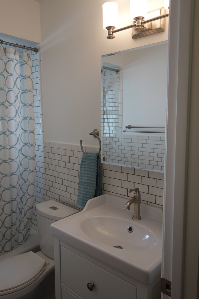 Small contemporary bathroom in Dallas with a console sink, an alcove bath, a one-piece toilet, white tiles, ceramic tiles, white walls and light hardwood flooring.