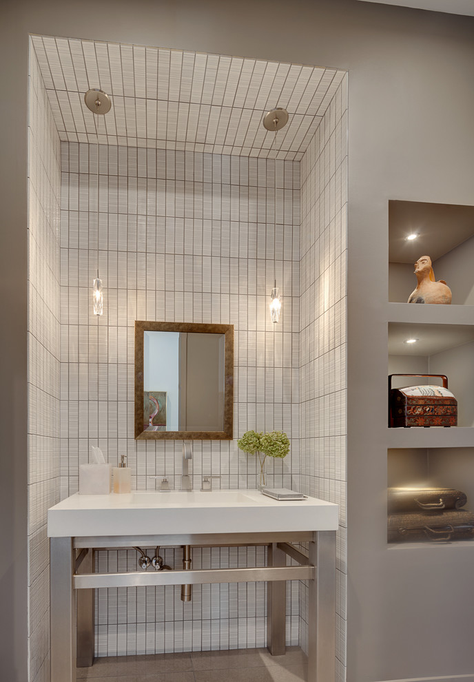 Design ideas for a medium sized contemporary bathroom in Chicago with white tiles, ceramic tiles, grey walls, porcelain flooring, an integrated sink and solid surface worktops.