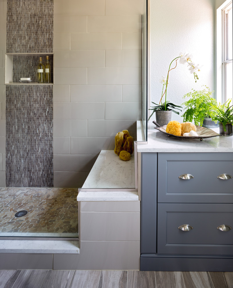 Inspiration for a large transitional master multicolored tile and porcelain tile medium tone wood floor corner shower remodel in Denver with shaker cabinets, gray cabinets, gray walls, an undermount sink and marble countertops