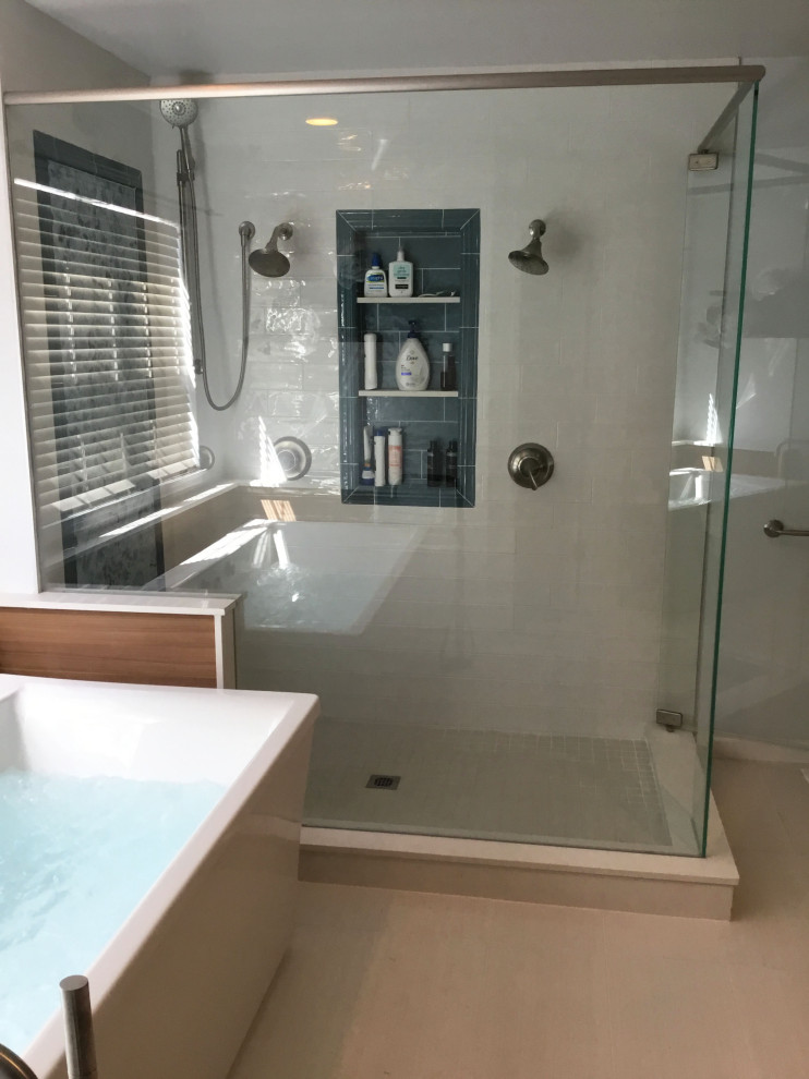 Design ideas for a medium sized contemporary ensuite bathroom in Denver with flat-panel cabinets, medium wood cabinets, a freestanding bath, a double shower, a two-piece toilet, white tiles, ceramic tiles, blue walls, cement flooring, a submerged sink, laminate worktops, a hinged door, brown worktops, a single sink and a freestanding vanity unit.