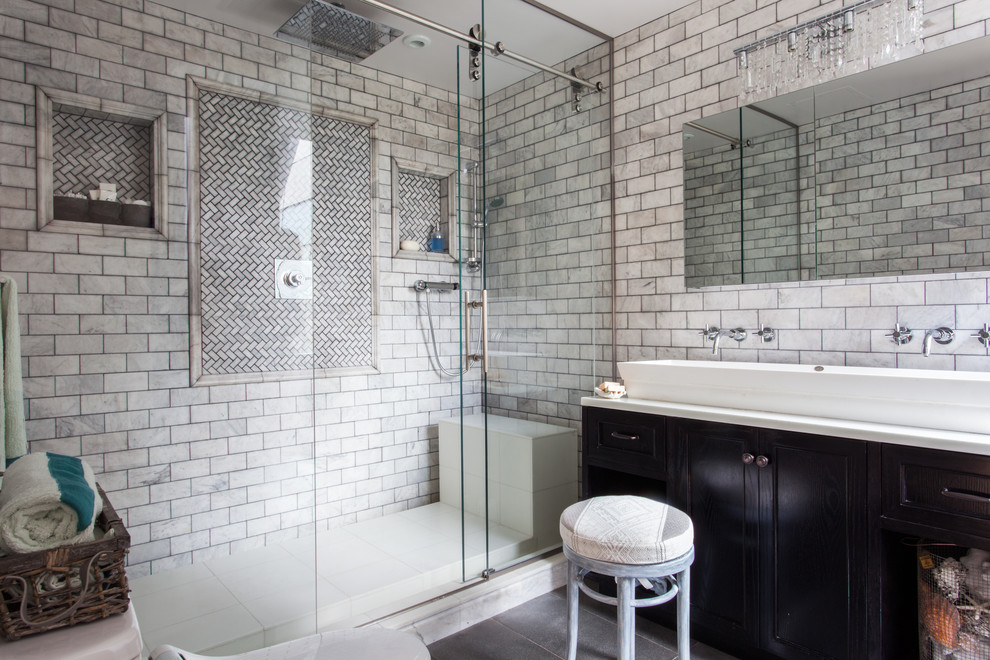 Photo of a contemporary bathroom in New York with metro tiles and a vessel sink.