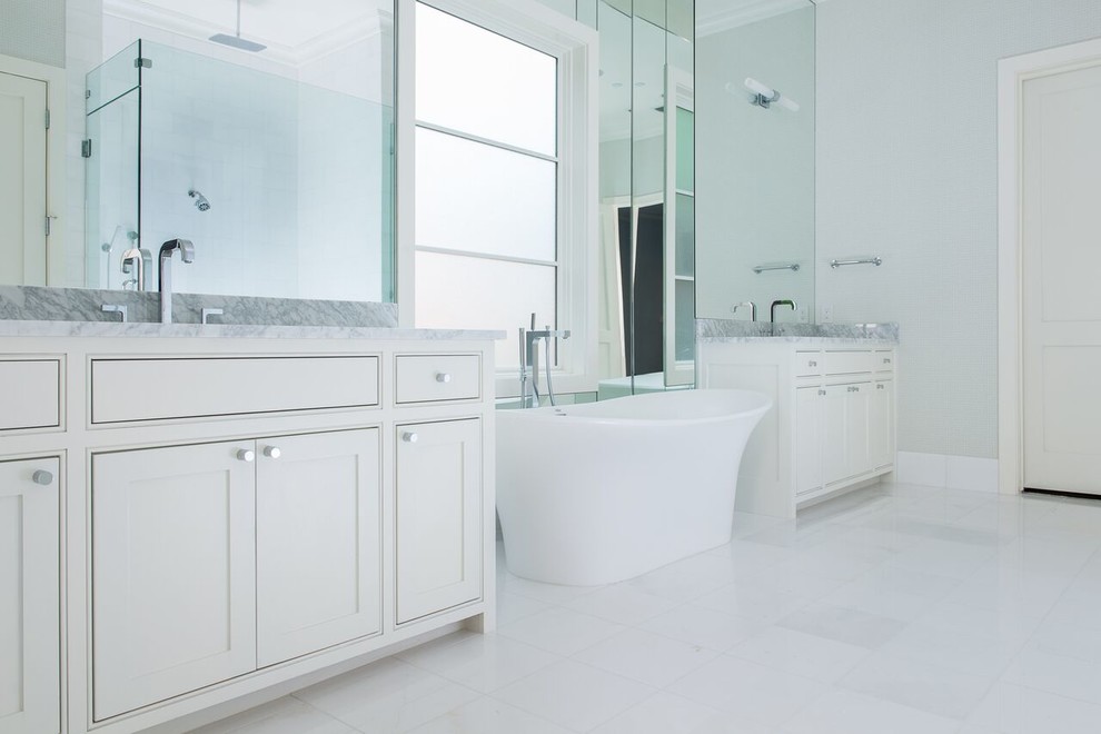 Design ideas for a large contemporary ensuite bathroom in Dallas with shaker cabinets, white cabinets, a freestanding bath, a corner shower, grey walls, porcelain flooring, a submerged sink and marble worktops.