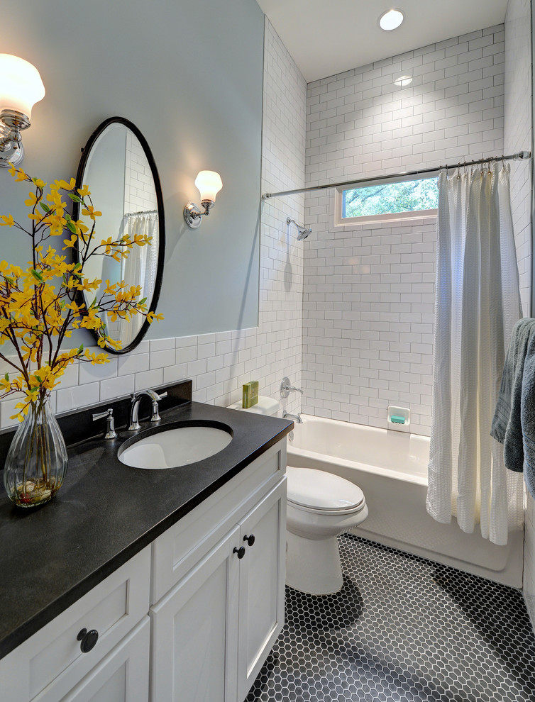 Tub/shower combo - mid-sized traditional white tile and ceramic tile mosaic tile floor tub/shower combo idea in Atlanta with an undermount sink, shaker cabinets, white cabinets, granite countertops, a one-piece toilet and blue walls