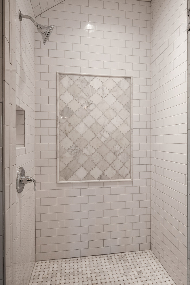 Alcove shower - mid-sized traditional 3/4 white tile marble floor alcove shower idea in Nashville with an undermount sink, recessed-panel cabinets, medium tone wood cabinets, granite countertops, a two-piece toilet and white walls