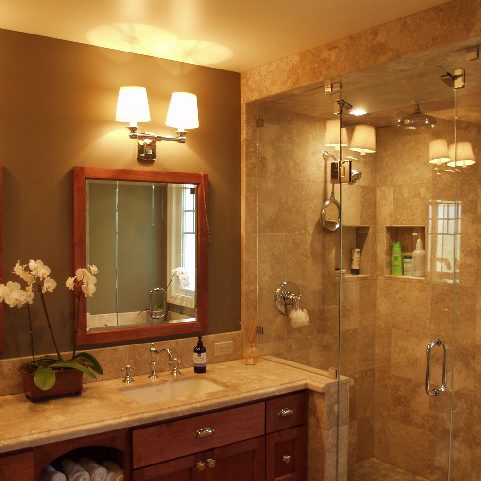 Example of a mid-sized arts and crafts beige tile and stone tile ceramic tile bathroom design in San Francisco with an undermount sink, shaker cabinets, medium tone wood cabinets, marble countertops, a one-piece toilet and brown walls