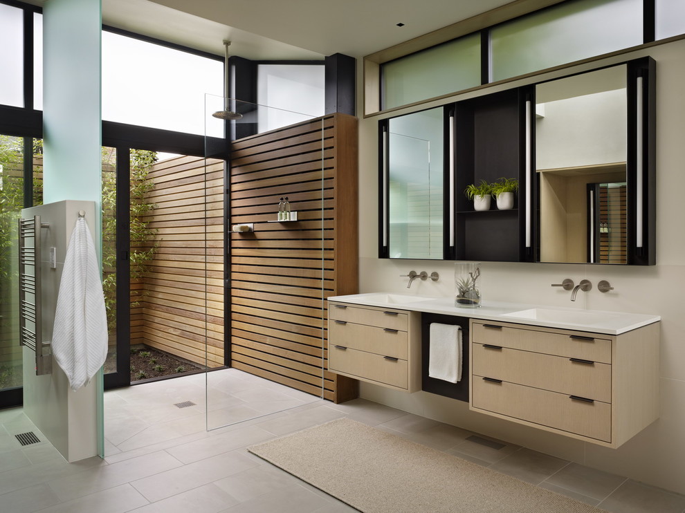 Bathroom - modern beige tile bathroom idea in Seattle with an integrated sink, flat-panel cabinets and light wood cabinets