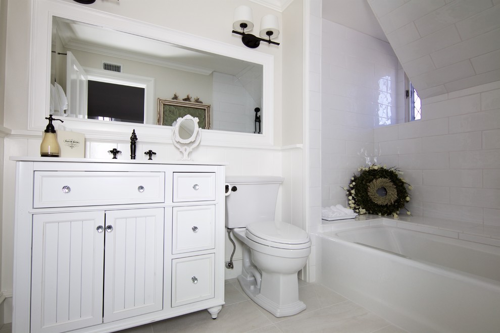 Inspiration for a large contemporary master white tile and subway tile slate floor and beige floor corner shower remodel in Orange County with beaded inset cabinets, white cabinets, a two-piece toilet, beige walls, an undermount sink, quartzite countertops, an undermount tub and a hinged shower door