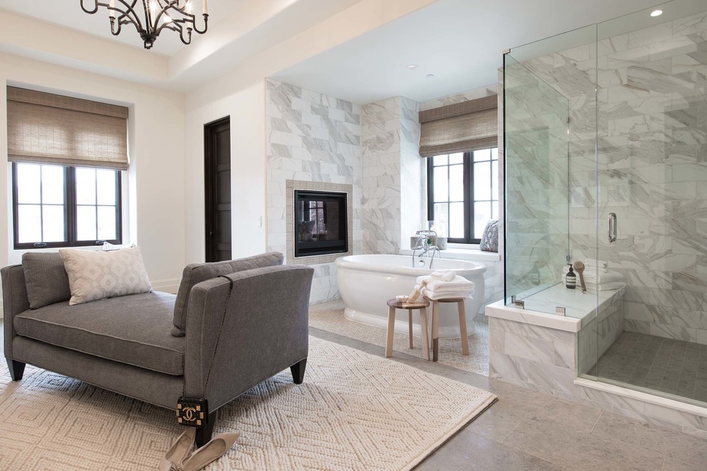 Photo of a mediterranean shower room bathroom in Orange County with a freestanding bath, a corner shower, grey tiles, white walls, grey floors and a hinged door.