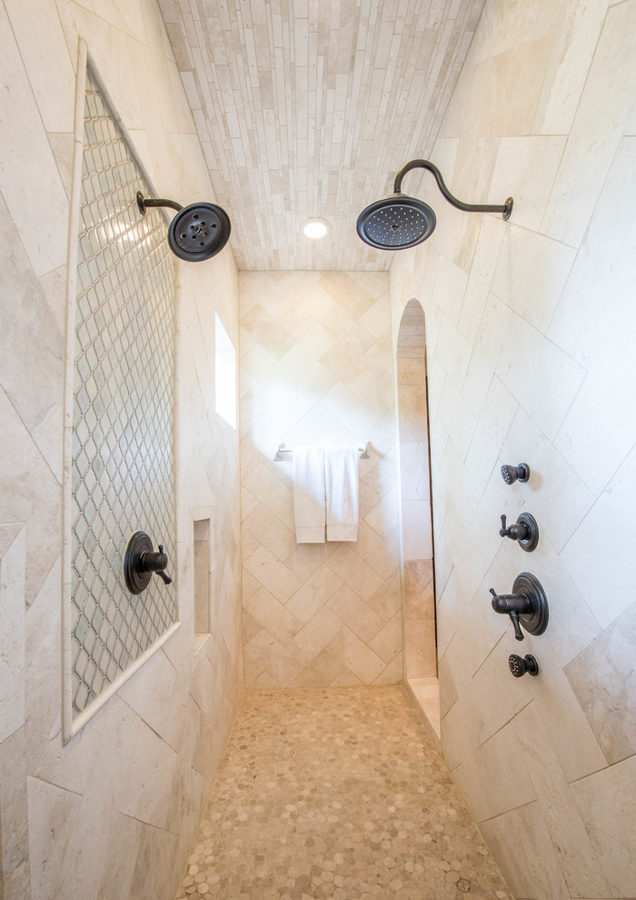 Inspiration for a large mediterranean master beige tile and ceramic tile ceramic tile and beige floor bathroom remodel in Houston with raised-panel cabinets, dark wood cabinets, green walls, an undermount sink and marble countertops