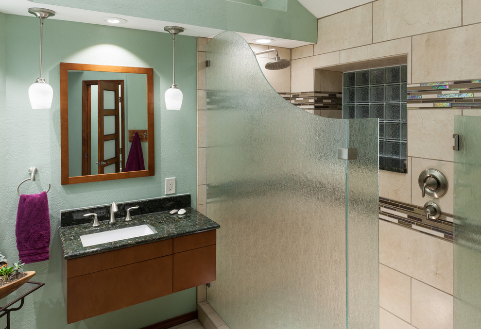 Inspiration for a mid-sized transitional 3/4 walk-in shower remodel in Dallas with flat-panel cabinets, medium tone wood cabinets, blue walls, an undermount sink and granite countertops