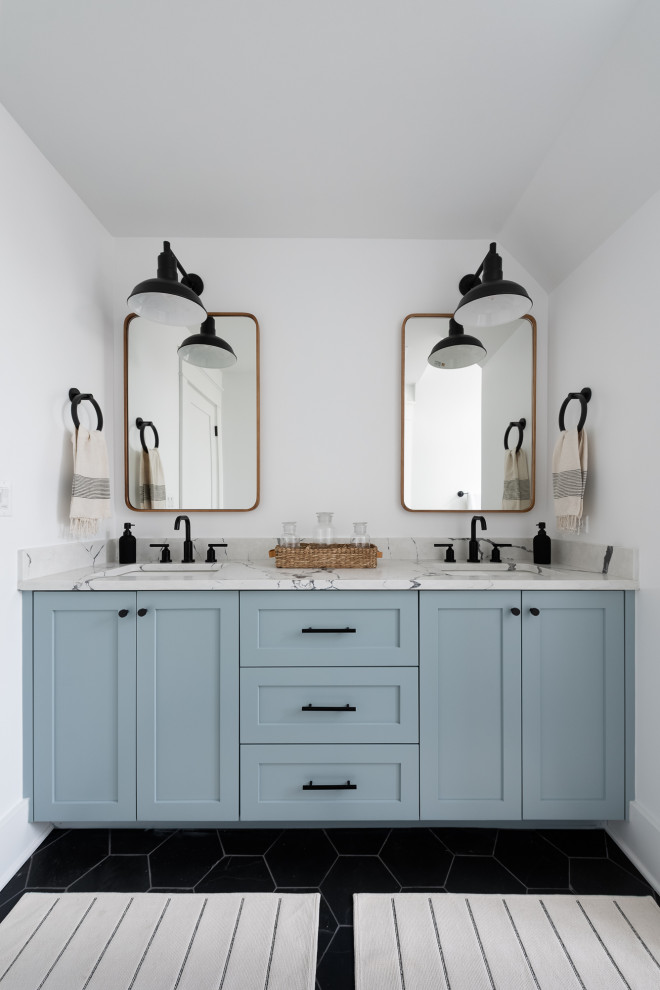 Inspiration for a country bathroom in Chicago with shaker cabinets, blue cabinets, white walls, a submerged sink, black floors, multi-coloured worktops, double sinks and a built in vanity unit.
