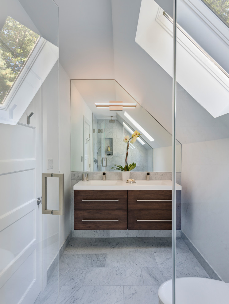 Mid-sized minimalist master gray tile, white tile and marble tile marble floor and multicolored floor walk-in shower photo in Boston with flat-panel cabinets, dark wood cabinets, a two-piece toilet, white walls, an integrated sink, quartz countertops, a hinged shower door and white countertops