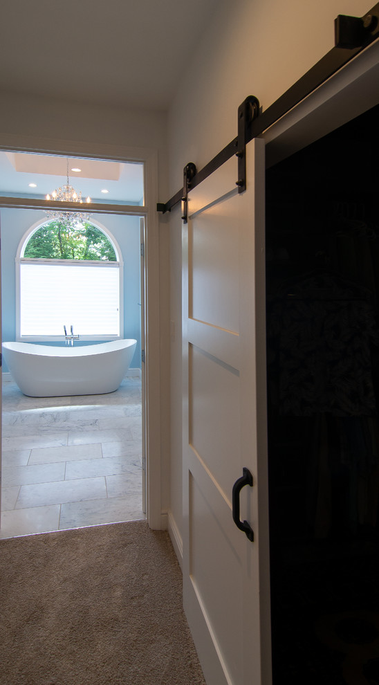 This is an example of a traditional bathroom in Other with a freestanding bath.