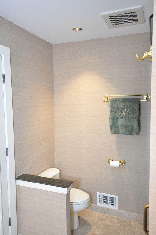 This is an example of a large classic shower room bathroom in Philadelphia with a submerged sink, flat-panel cabinets, light wood cabinets, marble worktops, an alcove shower, a one-piece toilet, black tiles, ceramic tiles, beige walls and ceramic flooring.