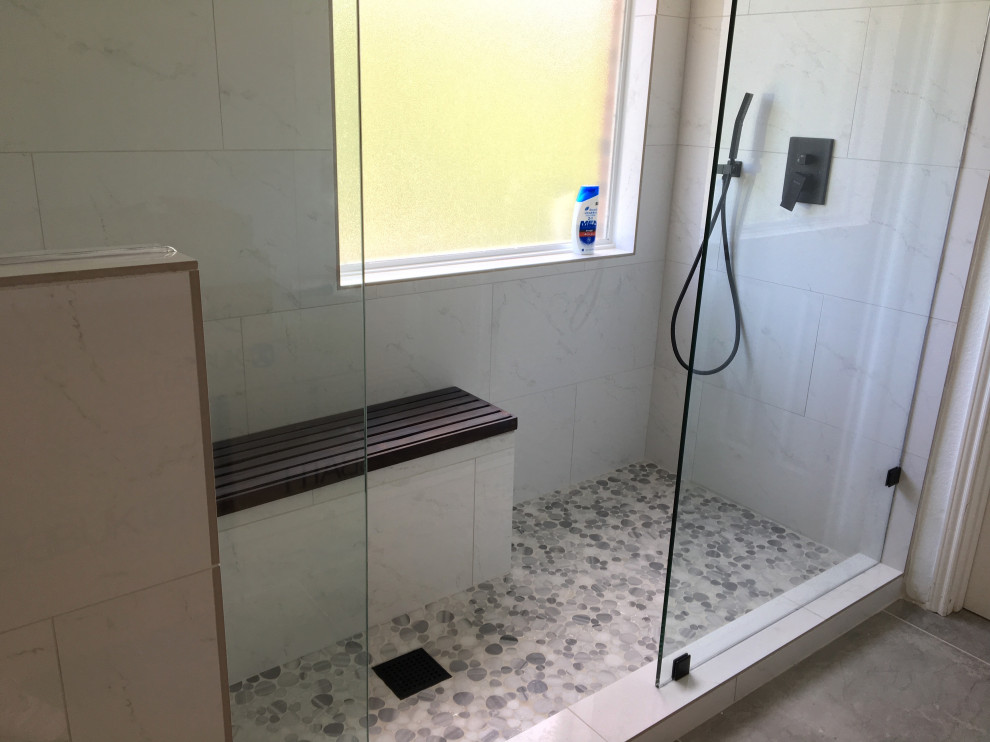 Large modern ensuite bathroom in Dallas with white cabinets, a double shower, white tiles, ceramic tiles, white walls, ceramic flooring, engineered stone worktops, grey floors and an open shower.