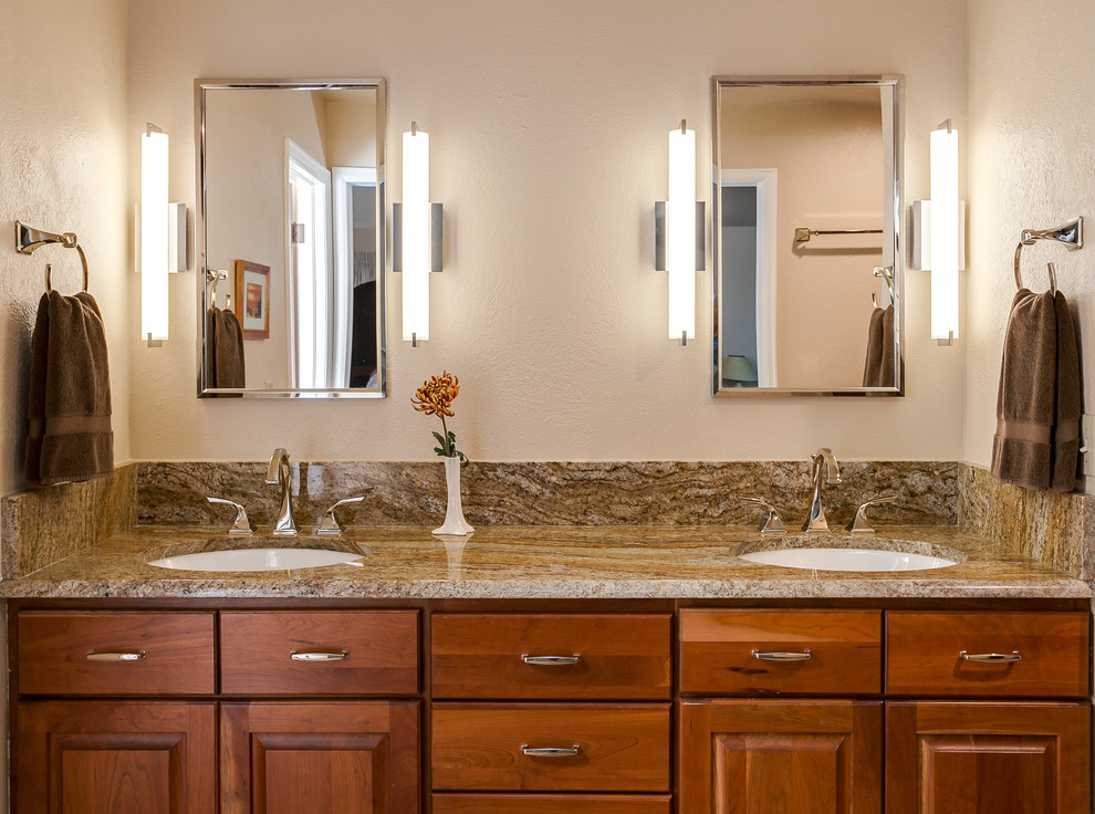 Inspiration for a large modern master brown tile and ceramic tile ceramic tile bathroom remodel in Denver with raised-panel cabinets, medium tone wood cabinets, granite countertops and beige walls