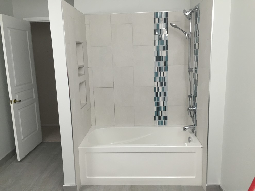 Mid-sized transitional 3/4 beige tile, multicolored tile and porcelain tile travertine floor and gray floor bathroom photo in Calgary with dark wood cabinets, white walls, an integrated sink, solid surface countertops, flat-panel cabinets and a one-piece toilet