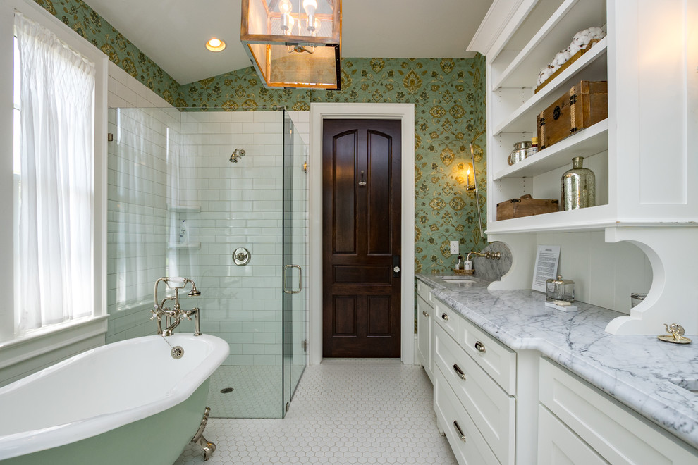 This is an example of a farmhouse bathroom in Nashville with recessed-panel cabinets, white cabinets, a claw-foot bath, a built-in shower, white tiles, metro tiles, green walls, mosaic tile flooring, a submerged sink, white floors, a hinged door and grey worktops.