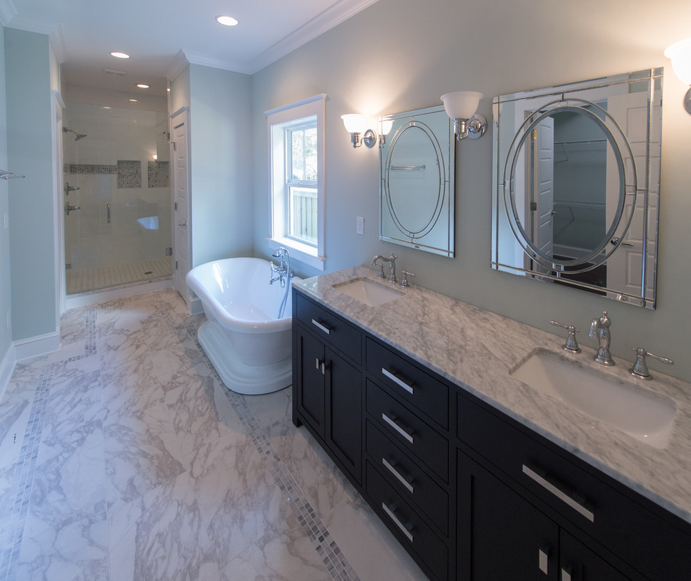 Bathroom - victorian white tile and ceramic tile marble floor bathroom idea in Jacksonville with shaker cabinets, dark wood cabinets, a two-piece toilet, gray walls, an undermount sink and marble countertops