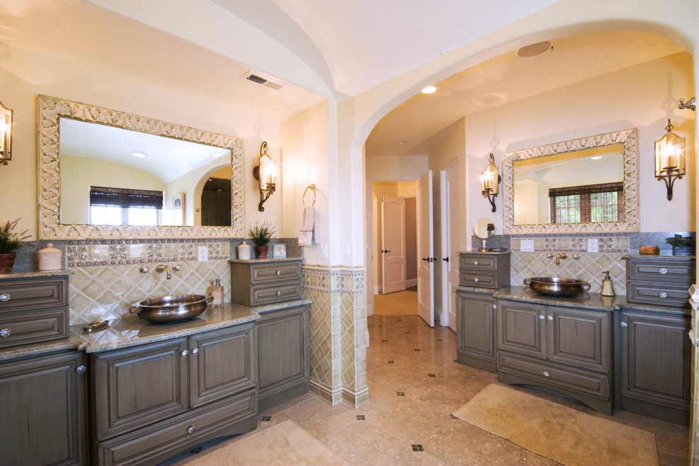 Example of a huge tuscan master beige tile porcelain tile and multicolored floor bathroom design with furniture-like cabinets, green cabinets, a vessel sink and multicolored countertops