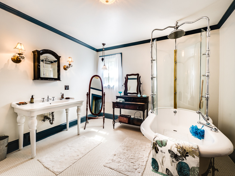 Photo of a traditional bathroom in New York with a claw-foot bath, a shower/bath combination, white walls, porcelain flooring, a console sink and white floors.