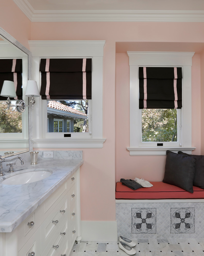 Example of a tuscan gray tile bathroom design in San Francisco with an undermount sink, recessed-panel cabinets, white cabinets and pink walls