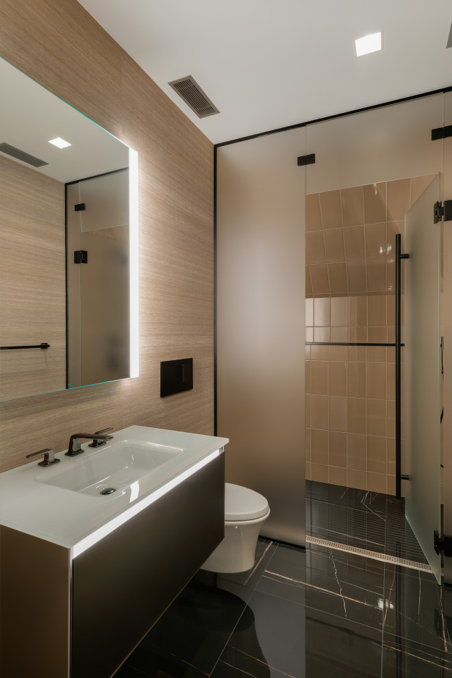 This is an example of a contemporary bathroom in Minneapolis with flat-panel cabinets, black cabinets, an alcove shower, beige tiles, an integrated sink, black floors, a hinged door, white worktops, a single sink and a floating vanity unit.