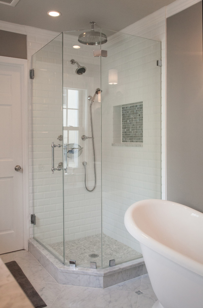 Photo of a large classic bathroom in Philadelphia with raised-panel cabinets, white cabinets and porcelain flooring.